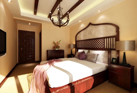 卧室选用了深木色，金色丝制布料结合光线的变化，创造出内敛谦卑的感觉。