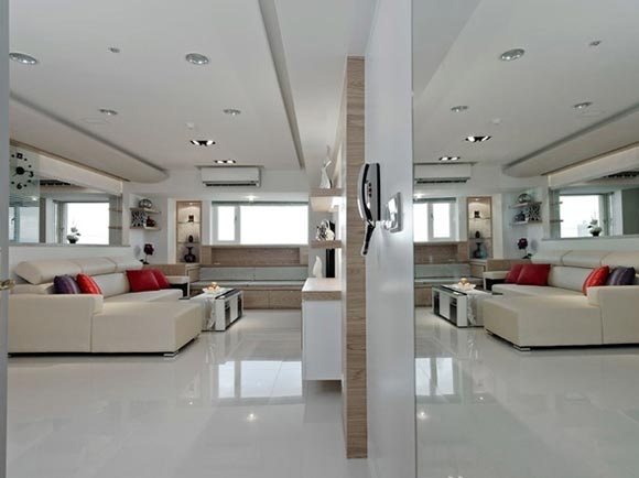客厅是居室的门面一定要好好打造，客厅多层次的线条使整个空间具有延伸感，石膏板吊顶，实木的家居增加空间的线条美。