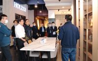 携手并行同谋发展，居然之家团队莅临霍尔茨门业参观交流