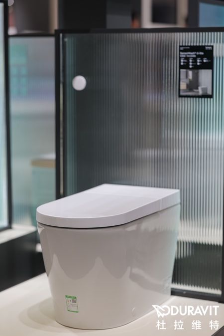 A white toilet in a bathroom AI-generated content may be incorrect.