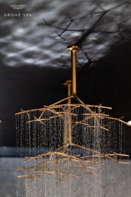 A gold chandelier with water running from it AI-generated content may be incorrect.
