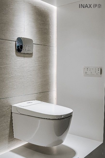 A toilet in a bathroom AI-generated content may be incorrect.